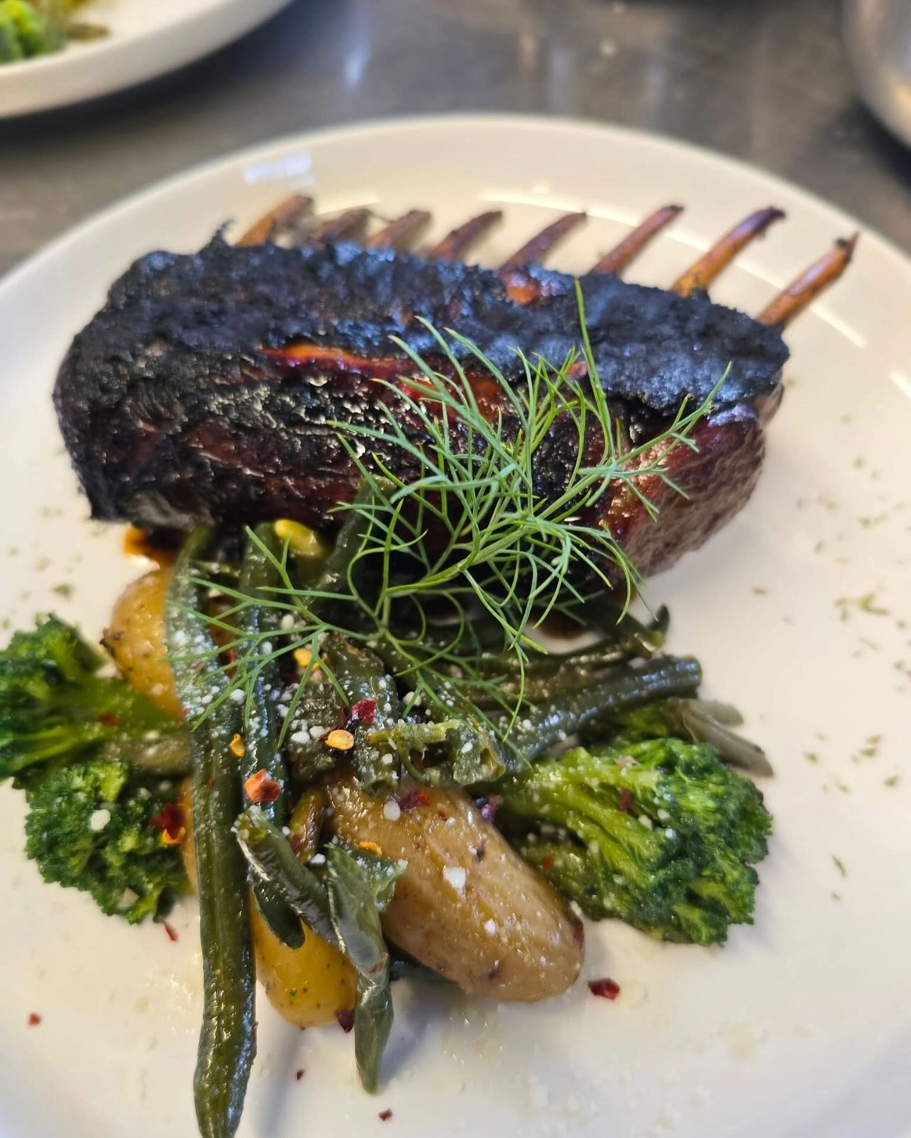Rack of lamb with roasted vegetables at Zarra's Restaurant